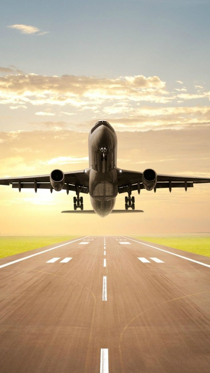 A large passenger jet taking off from an airport runway, representing the best travel agency in Dubai.