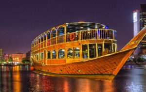 boat-with-spacious-wooden-deck-gliding-across-water-representing-travel-agency-in-dubai.jpg