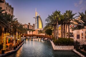 Panoramic-view-of-Dubai-skyline-showcasing-modern-architecture-against-clear-blue-sky-in-January-2019.jpg
