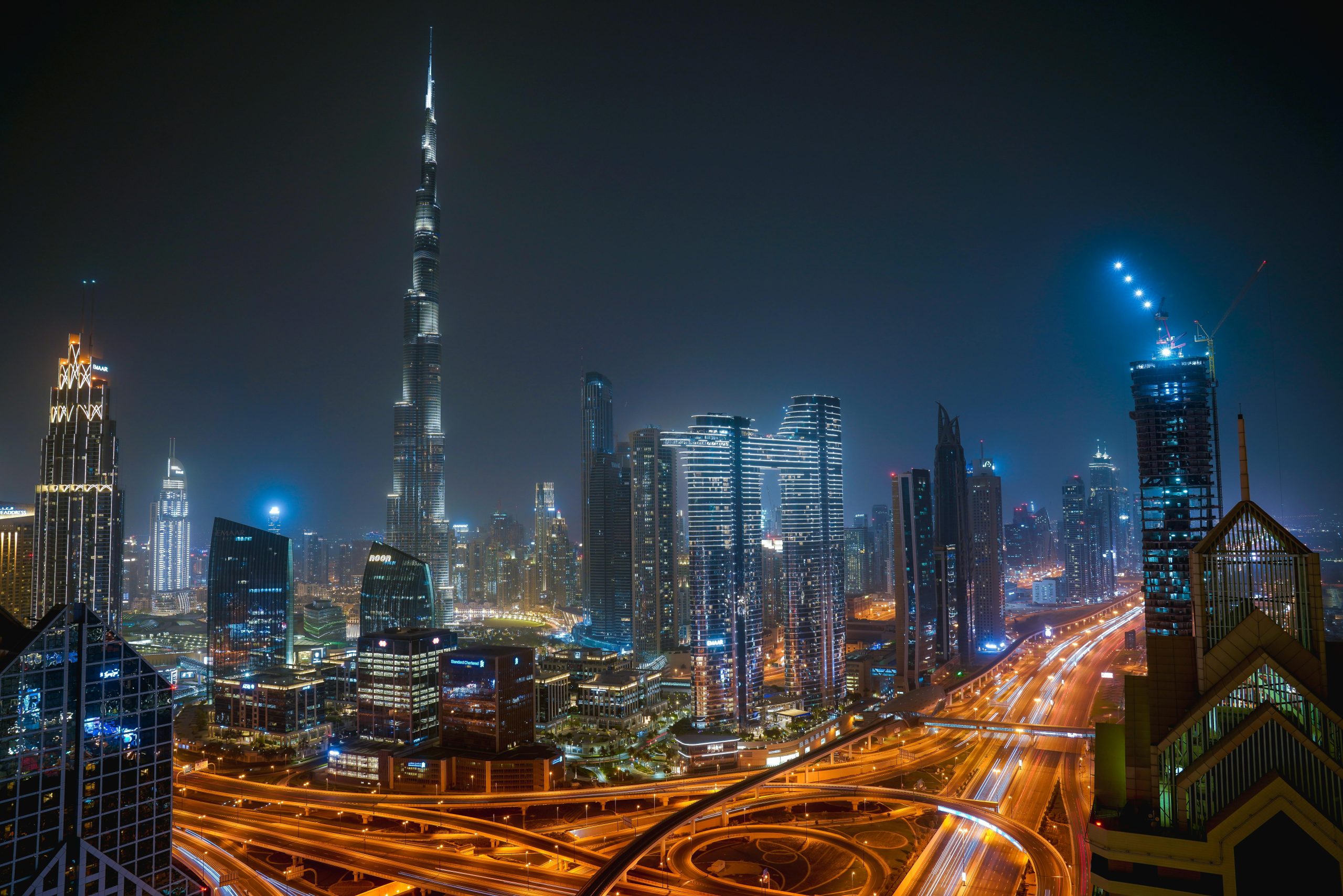 Stunning-Dubai-skyline-illuminated-at-night,-showcasing-iconic-skyscrapers-and-vibrant-city-lights-for-travel-enthusiasts.jpg
